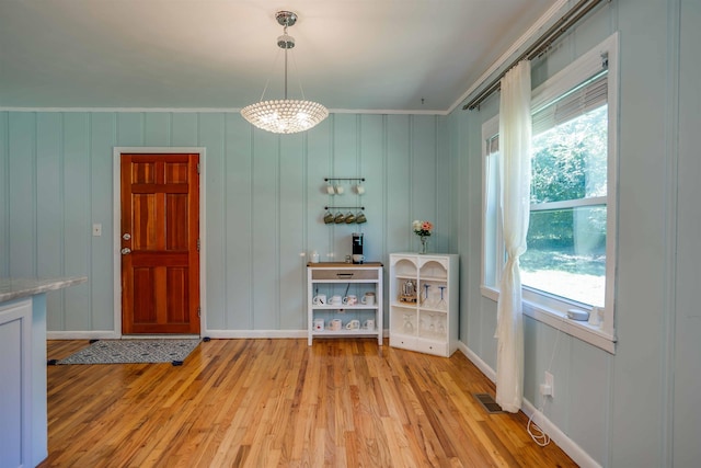 unfurnished dining area with light hardwood / wood-style flooring