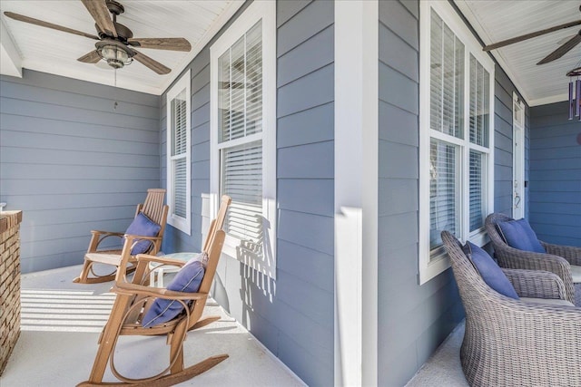 balcony featuring ceiling fan and a porch