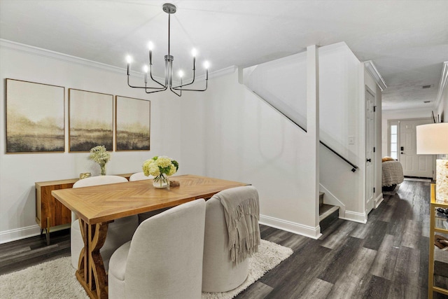 dining area with a chandelier, wood finished floors, baseboards, ornamental molding, and stairway