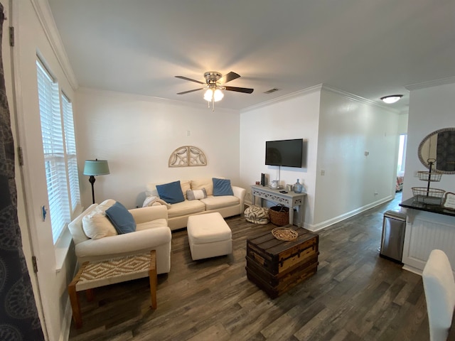 living room featuring ceiling fan, crown molding, and dark hardwood / wood-style flooring