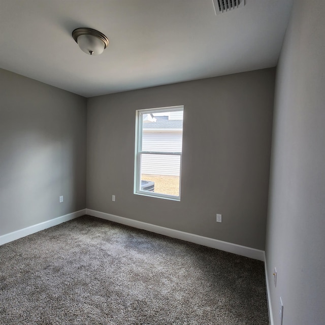 spare room featuring carpet flooring