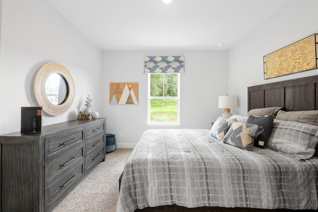 bedroom featuring light colored carpet