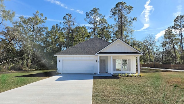 view of front of house with a garage and a front lawn