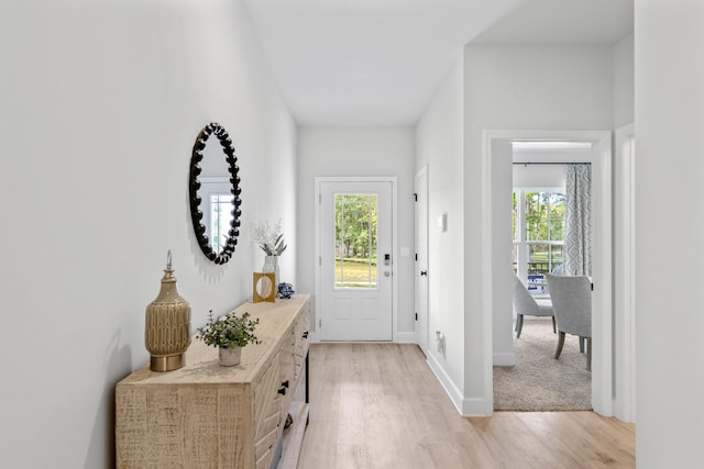 doorway with light hardwood / wood-style floors