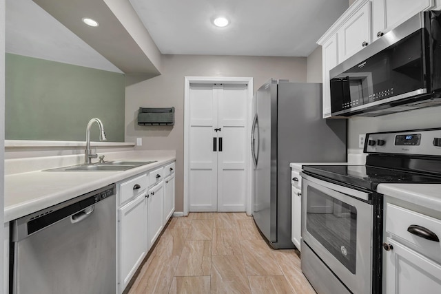 7326 Hollis St, Tallahassee, FL 32312 - kitchen with appliances with stainless steel finishes, white cabinetry, light countertops, and recessed lighting