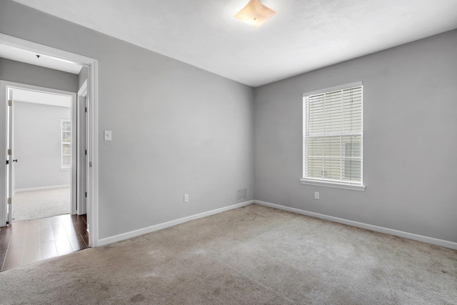 7326 Hollis St, Tallahassee, FL 32312 - empty room with carpet floors and baseboards