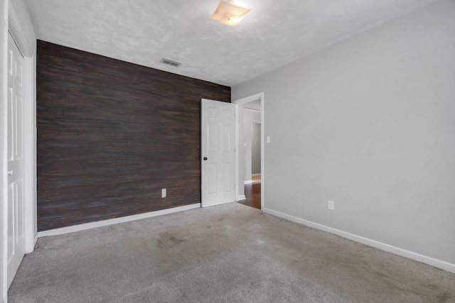 7326 Hollis St, Tallahassee, FL 32312 - empty room featuring carpet floors and wood walls