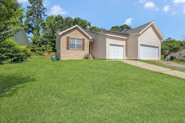 7326 Hollis St, Tallahassee, FL 32312 - view of front of house with an attached garage, a front yard, brick siding, and driveway