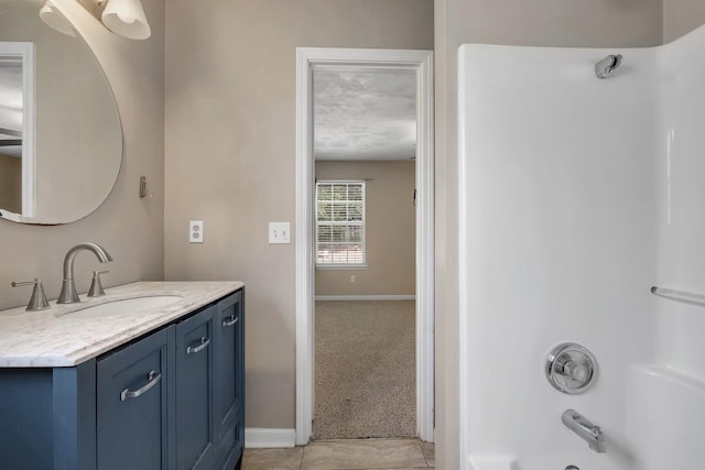 7326 Hollis St, Tallahassee, FL 32312 - bathroom with vanity, washtub / shower combination, and tile patterned flooring