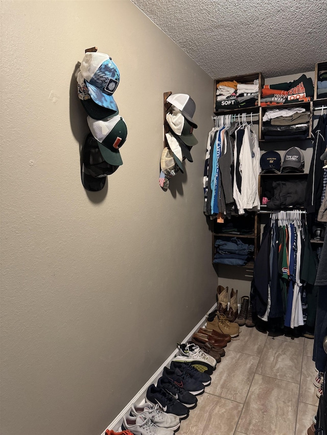 spacious closet with tile patterned flooring