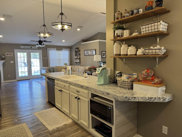 kitchen with dark hardwood / wood-style flooring, dishwasher, built in microwave, hanging light fixtures, and sink