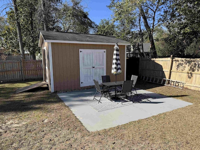 view of patio / terrace with a shed