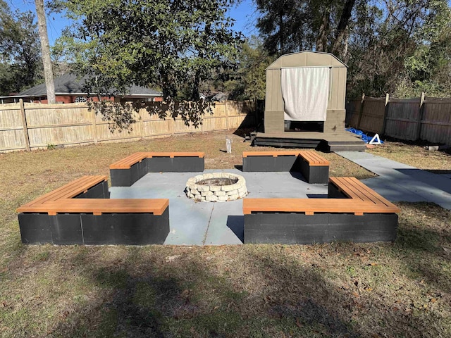 view of yard featuring an outdoor fire pit and a deck