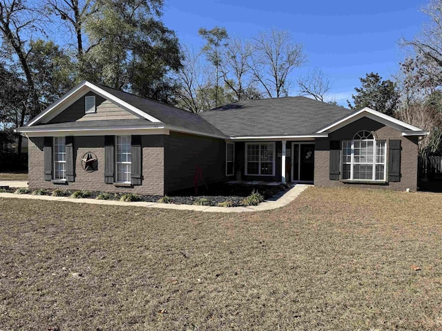 ranch-style home with a front lawn