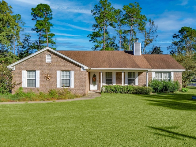 ranch-style house featuring a front lawn