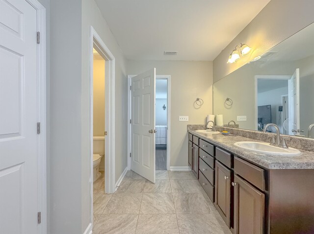 4641 Rivers Landing Way, Tallahassee, FL 32303 - bathroom with double vanity and toilet
