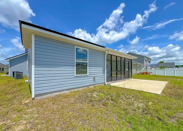 4641 Rivers Landing Way, Tallahassee, FL 32303 - rear view of house featuring a sunroom and a patio