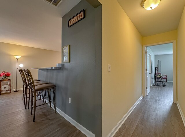 4641 Rivers Landing Way, Tallahassee, FL 32303 - hallway with wood finished floors and baseboards