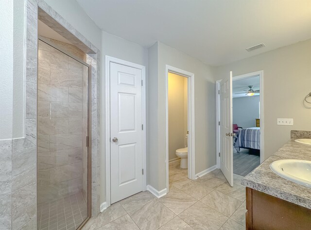 4641 Rivers Landing Way, Tallahassee, FL 32303 - bathroom with a stall shower, ensuite bathroom, double vanity, a ceiling fan, and tile patterned flooring