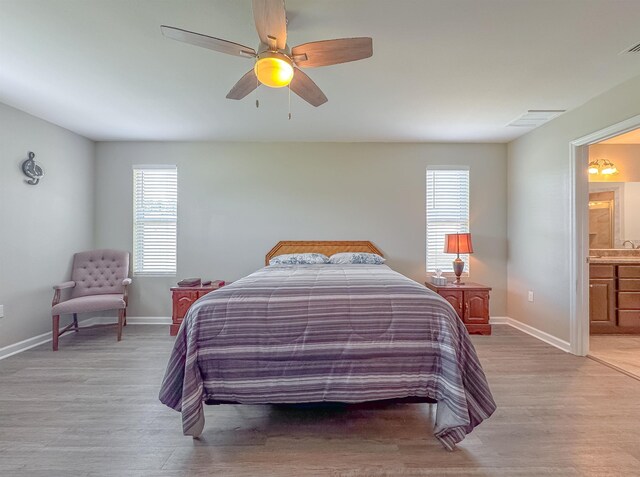4641 Rivers Landing Way, Tallahassee, FL 32303 - bedroom with light wood-style flooring, ensuite bathroom, and ceiling fan