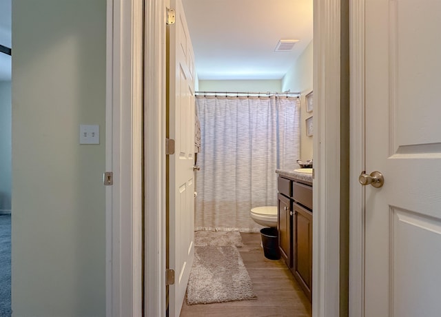 4641 Rivers Landing Way, Tallahassee, FL 32303 - full bathroom featuring vanity, wood finished floors, and curtained shower