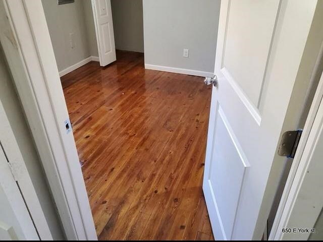 interior space with dark hardwood / wood-style floors