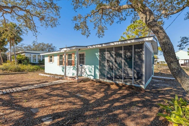 view of front of house with a sunroom