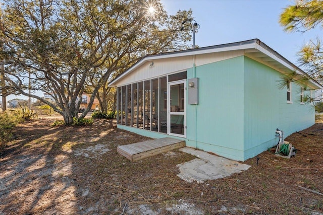 back of house with a sunroom