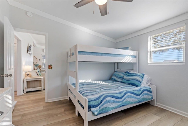 bedroom featuring ceiling fan and crown molding