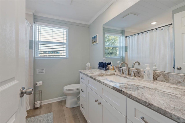 bathroom with toilet, vanity, hardwood / wood-style floors, and ornamental molding