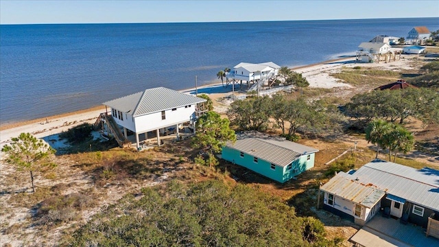 birds eye view of property featuring a view of the beach and a water view