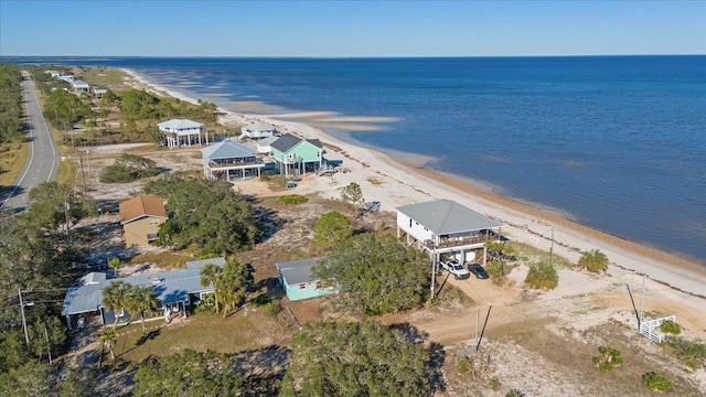 bird's eye view featuring a beach view and a water view