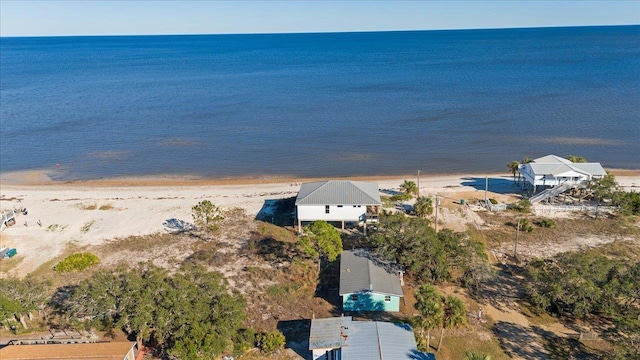 drone / aerial view featuring a view of the beach and a water view