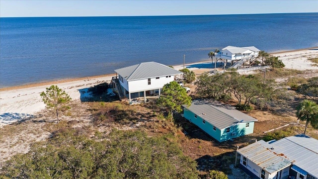 aerial view with a view of the beach and a water view