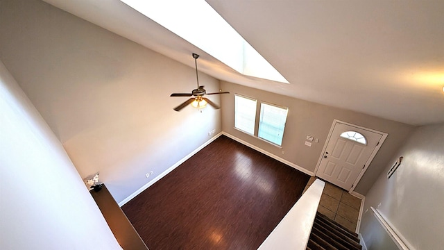 3320 Sugar Berry Way, Tallahassee, FL 32303 - foyer entrance with dark wood-type flooring, lofted ceiling with skylight, a ceiling fan, and baseboards