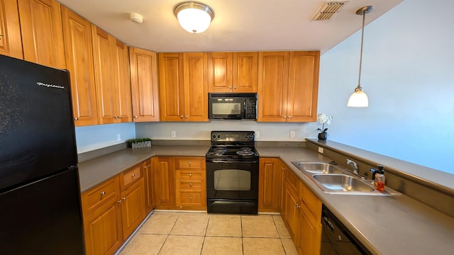 3320 Sugar Berry Way, Tallahassee, FL 32303 - kitchen with a sink, visible vents, black appliances, brown cabinetry, and light tile patterned floors