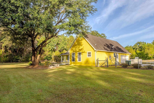 back of house featuring a yard