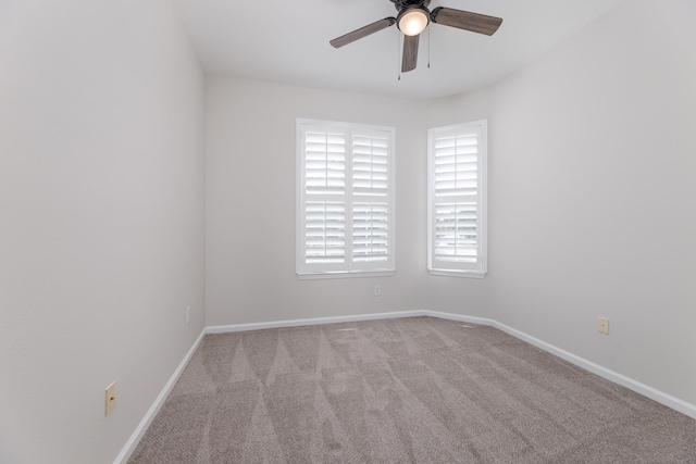 unfurnished room featuring light carpet and ceiling fan