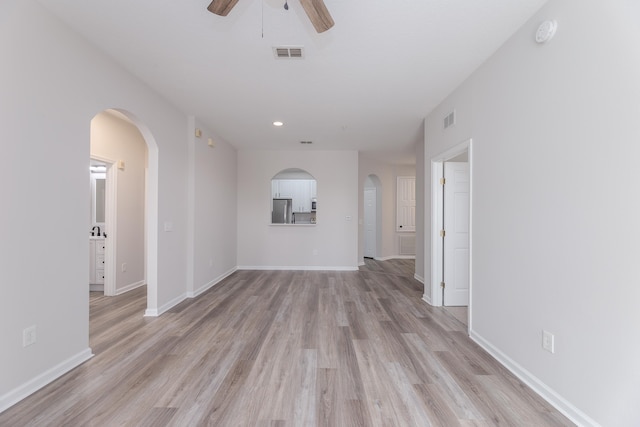 unfurnished room featuring ceiling fan and light hardwood / wood-style floors