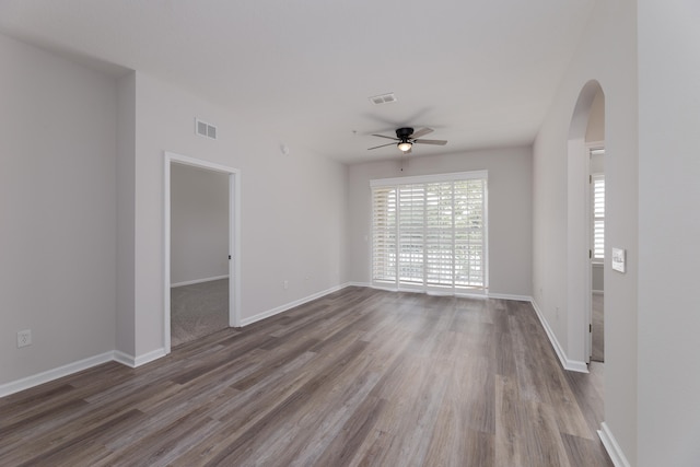 unfurnished room with hardwood / wood-style floors and ceiling fan