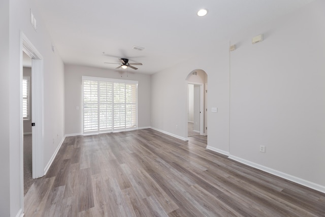 empty room with light hardwood / wood-style floors and ceiling fan