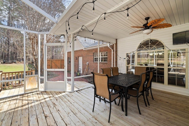 sunroom / solarium with ceiling fan