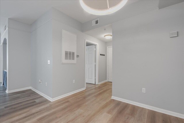 2801 Chancellorsville Dr Unit 1217, Tallahassee, FL 32312 - spare room with light wood-type flooring and arched walkways