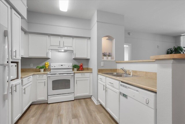 2801 Chancellorsville Dr Unit 1217, Tallahassee, FL 32312 - kitchen with white appliances, under cabinet range hood, light countertops, light wood-type flooring, and white cabinets