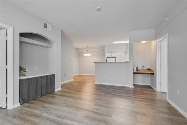 2801 Chancellorsville Dr Unit 1217, Tallahassee, FL 32312 - unfurnished living room featuring light wood-style flooring