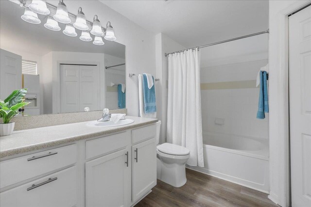 2801 Chancellorsville Dr Unit 1217, Tallahassee, FL 32312 - bathroom featuring vanity, shower / bathtub combination with curtain, wood finished floors, and a chandelier
