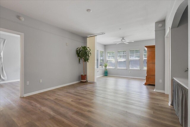 2801 Chancellorsville Dr Unit 1217, Tallahassee, FL 32312 - empty room featuring ceiling fan, wood finished floors, and a smoke detector