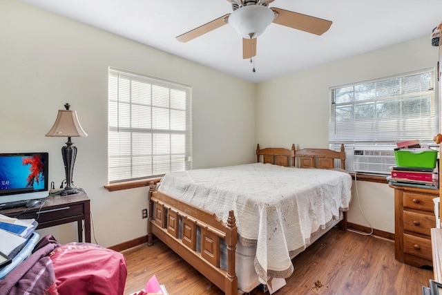 bedroom featuring ceiling fan and hardwood / wood-style floors