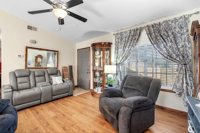 living room featuring light wood-type flooring, lofted ceiling, and ceiling fan