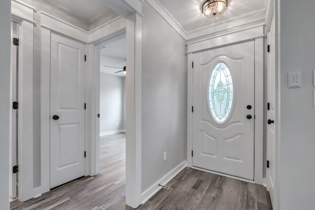 1695 Landing St, Carrabelle, FL 32322 - entryway with wood finished floors, a ceiling fan, and crown molding
